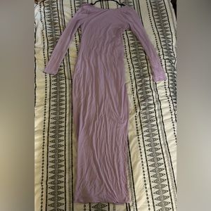 Fashion Nova lilac long sleeve, backless, with a slit on the left leg.